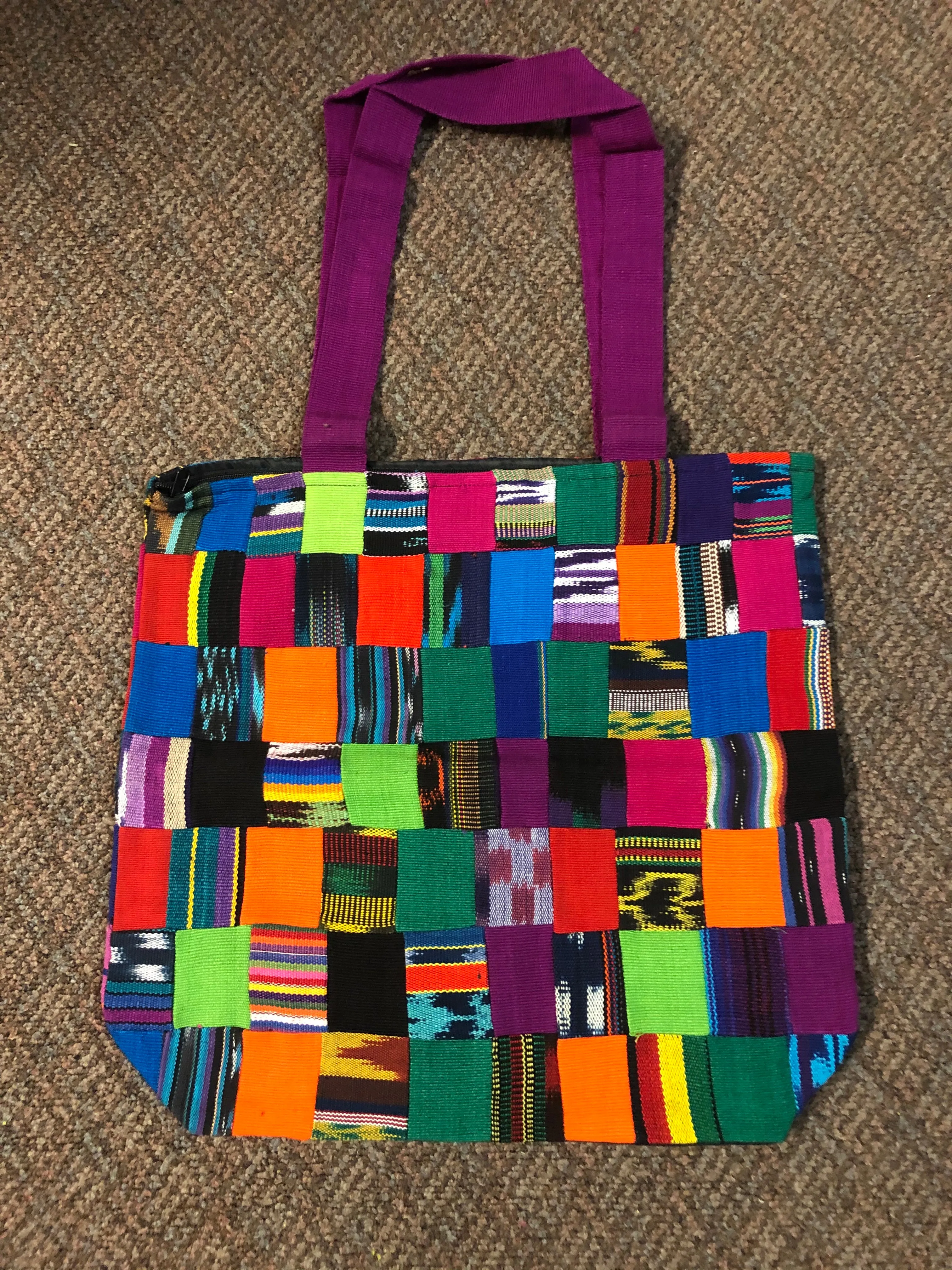 Handwoven Guatemalan cotton patches fashioned into a sturdy shoulder bag, fully lined with one zipper pocket. 15” x 17”