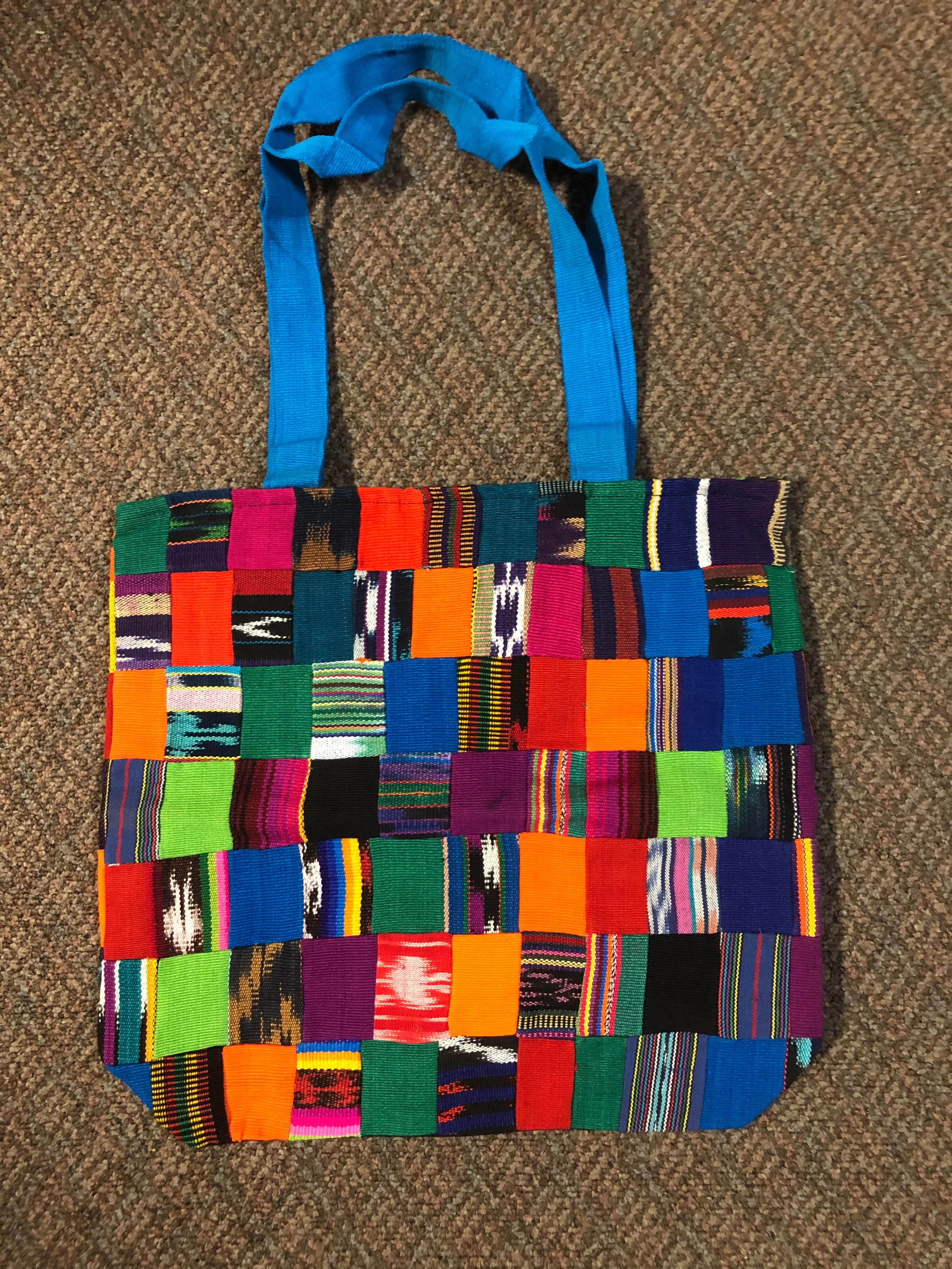 Handwoven Guatemalan cotton patches fashioned into a sturdy shoulder bag, fully lined with one zipper pocket. 15” x 17”